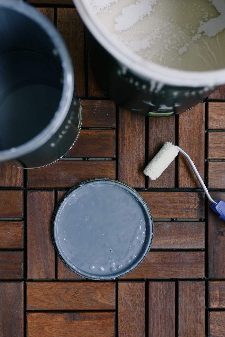 cans with color and paint roller